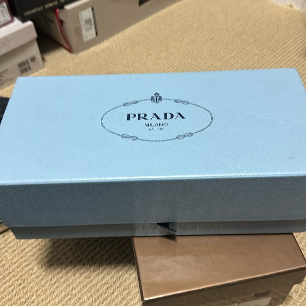 White with silver tip Prada flat